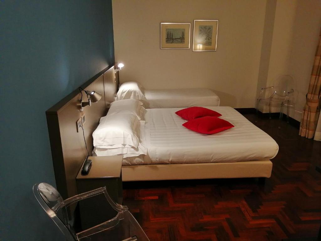 Postel nebo postele na pokoji v ubytování Locanda Giustini