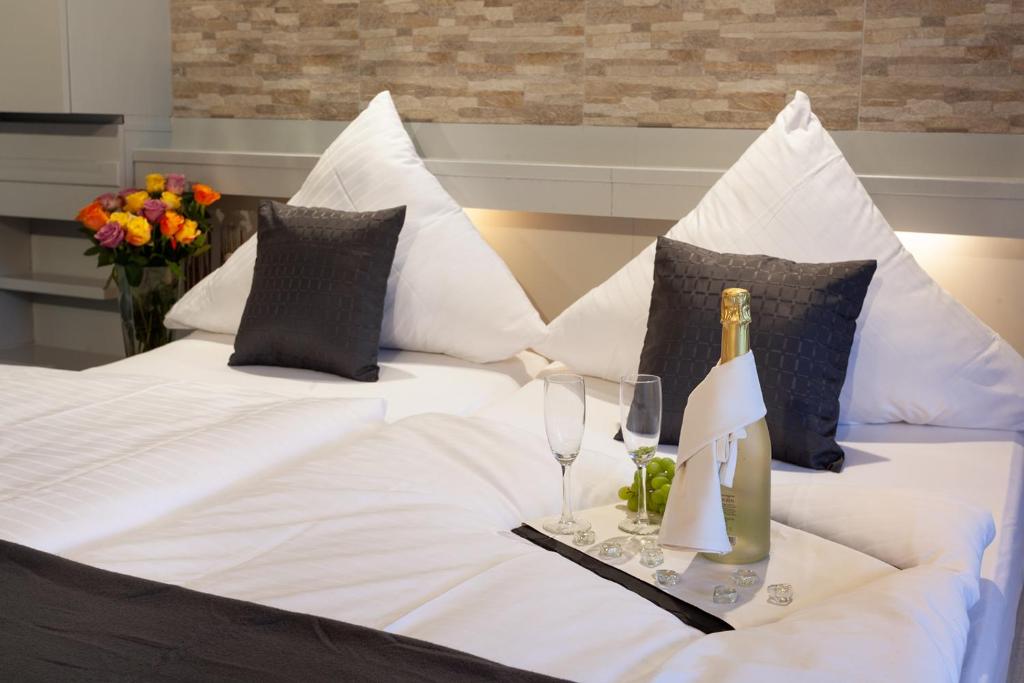 Postel nebo postele na pokoji v ubytování Hotel Petra