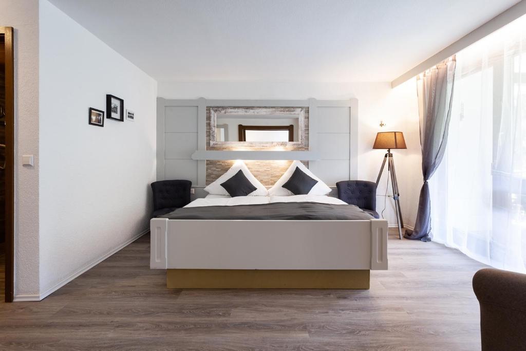 Postel nebo postele na pokoji v ubytování Hotel Petra