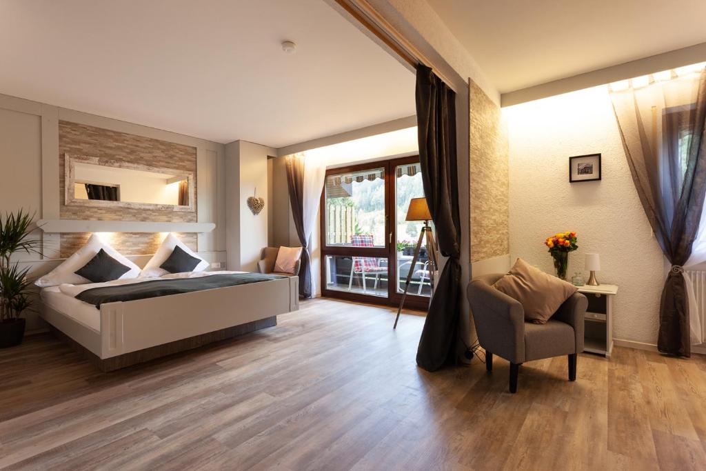 Postel nebo postele na pokoji v ubytování Hotel Petra