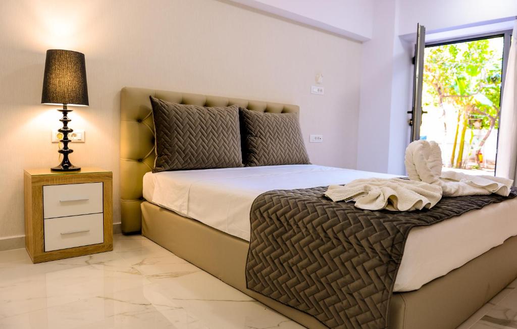 Postel nebo postele na pokoji v ubytování Island Dreams Rooms & Suites