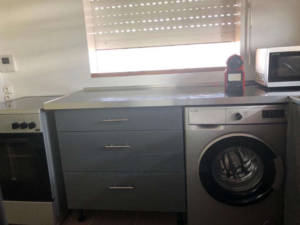 Kuchyň nebo kuchyňský kout v ubytování Appartement résidentiel