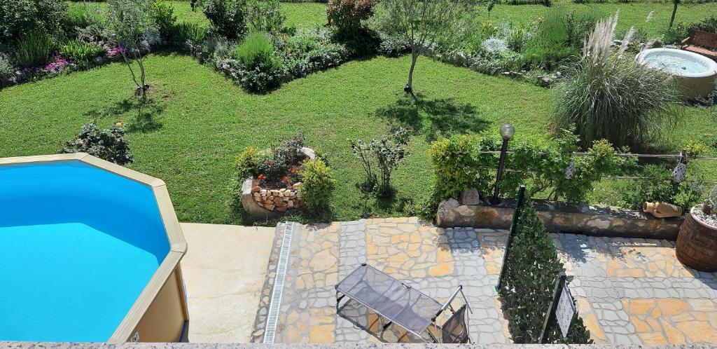 an aerial view of a garden with a swimming pool at Apartments Demori in Galižana