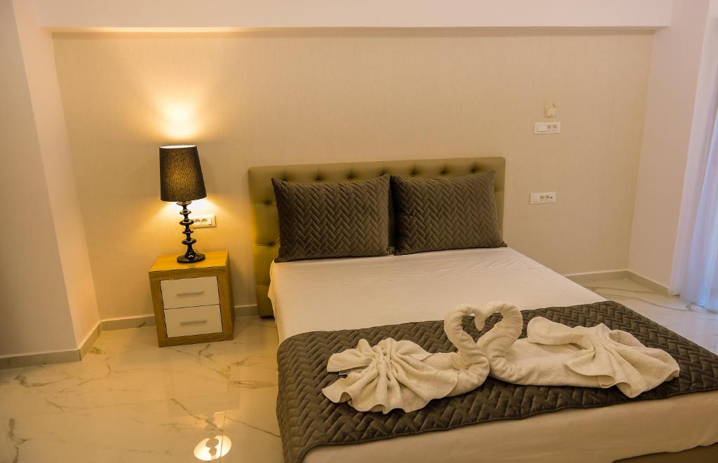 Postel nebo postele na pokoji v ubytování Island Dreams Rooms & Suites