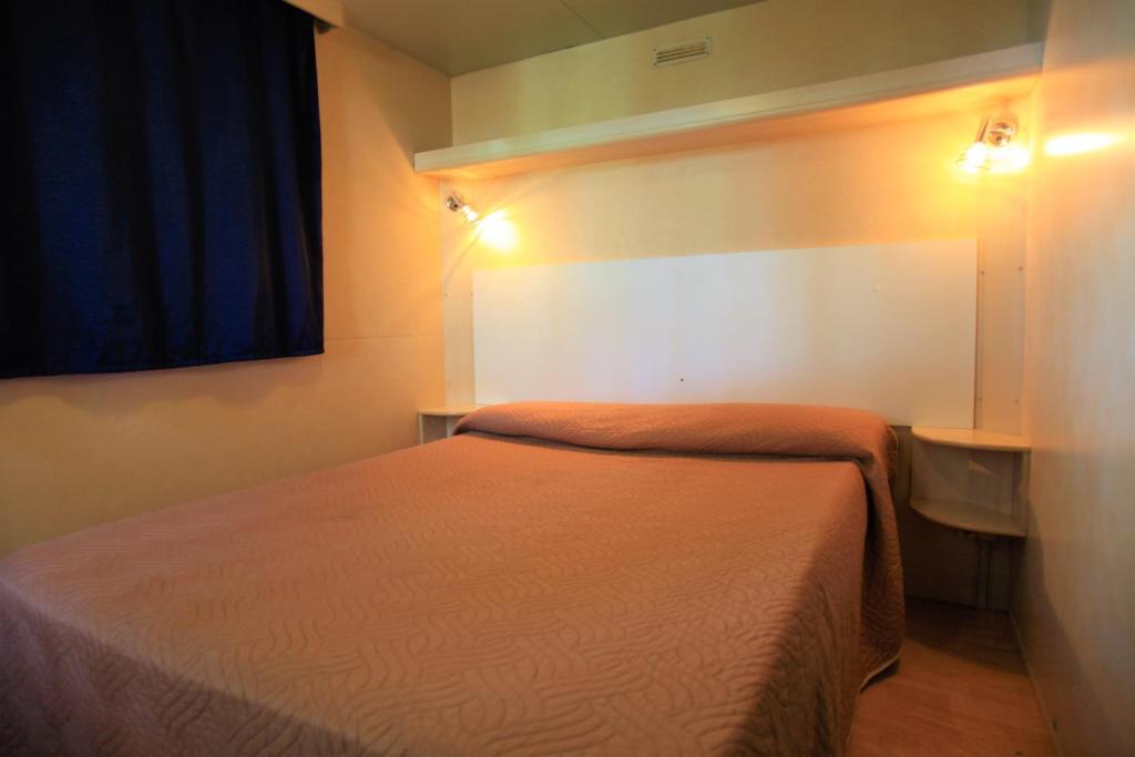 Postel nebo postele na pokoji v ubytování Camping Bella Sardinia