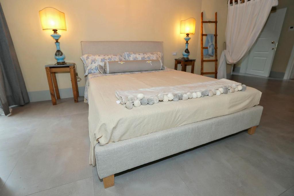 Postel nebo postele na pokoji v ubytování B&B CASAGRANDE