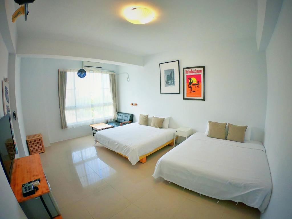 Postel nebo postele na pokoji v ubytování Imanuel Surfing B&B