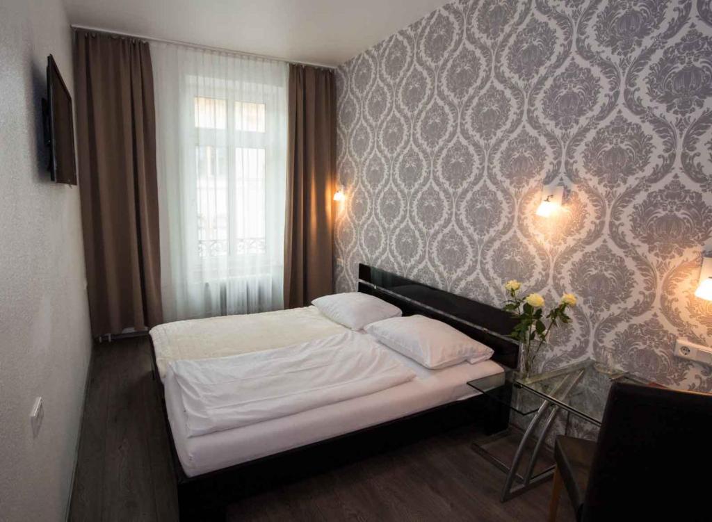 Postel nebo postele na pokoji v ubytování Hotel Luisenhof