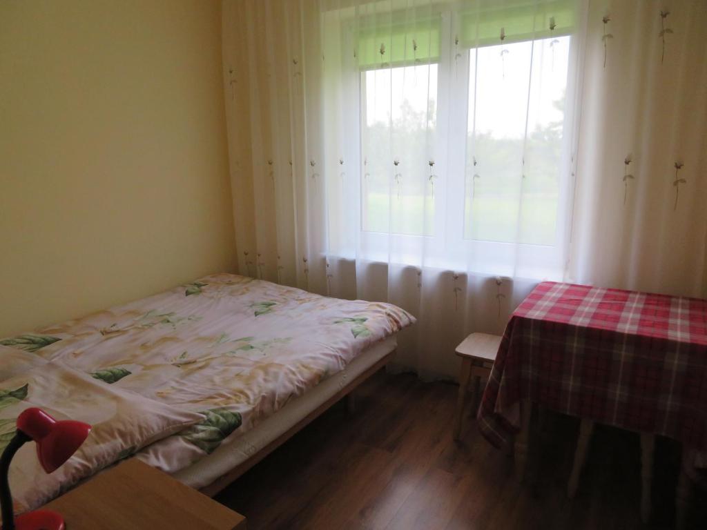 Een bed of bedden in een kamer bij Agroturystyka Agnieszki Murszewskiej