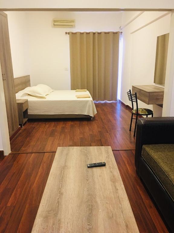 Postel nebo postele na pokoji v ubytování Divan Hotel Apartments