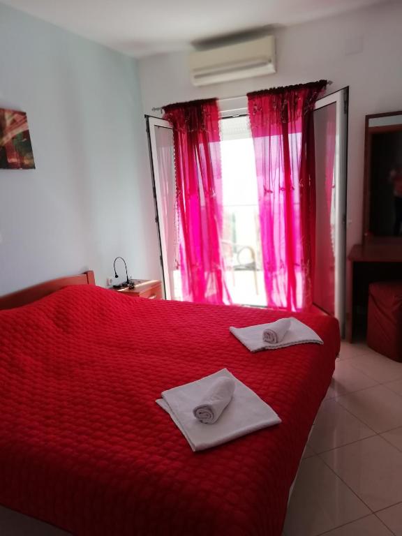 Postel nebo postele na pokoji v ubytování Villa Kubo