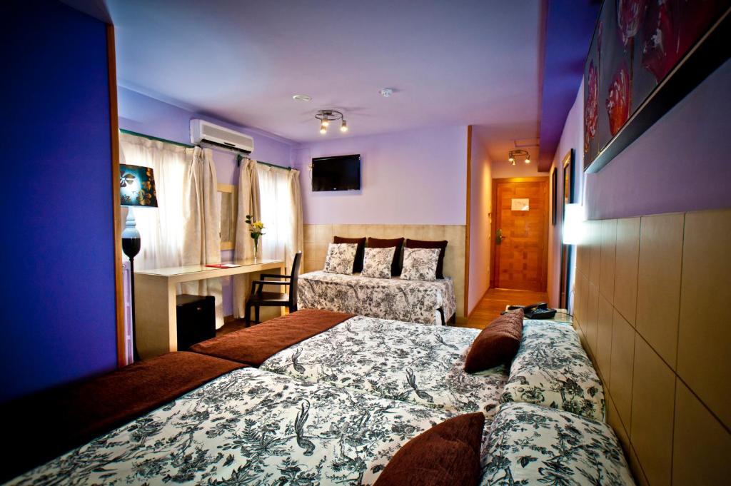 Postel nebo postele na pokoji v ubytování Hotel Condes de Castilla