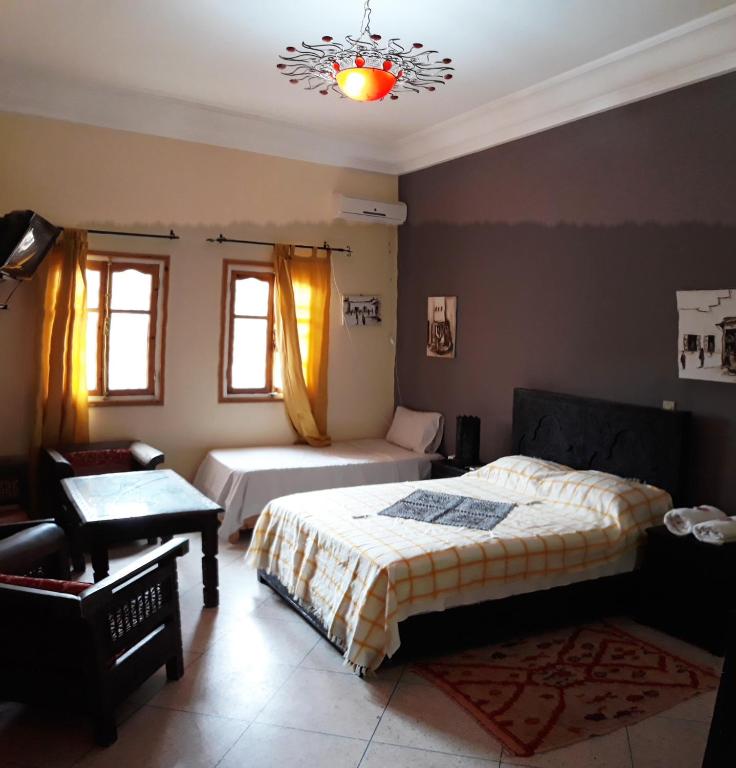 Postel nebo postele na pokoji v ubytování Ecolodge Espace Tamount