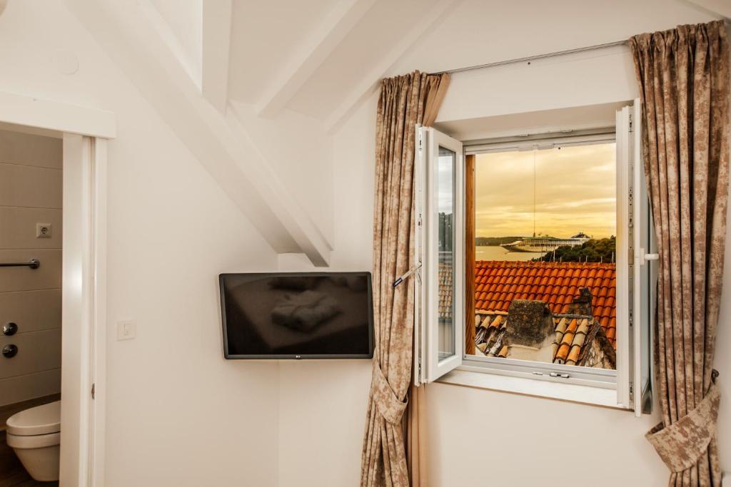 TV a/nebo společenská místnost v ubytování Heritage Hotel Dea Hvar