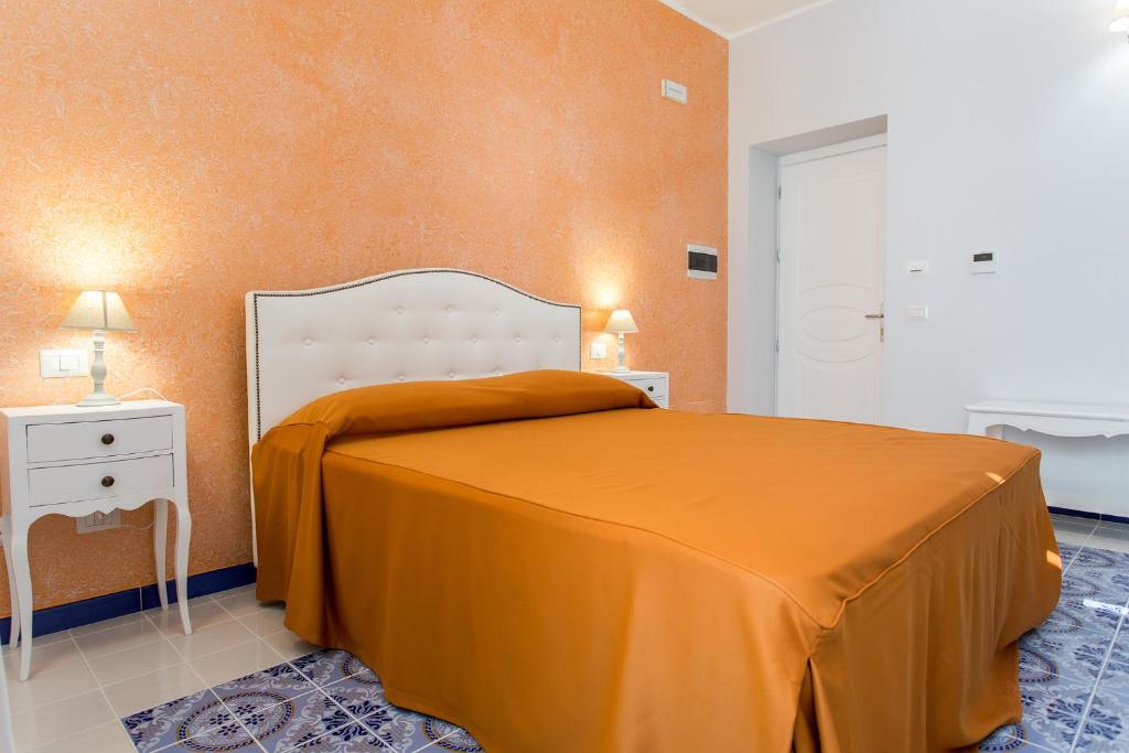 Postel nebo postele na pokoji v ubytování Odysseus Hotel