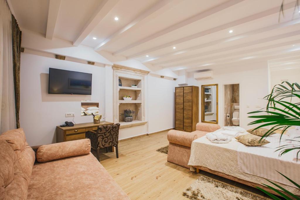 Postel nebo postele na pokoji v ubytování Heritage Hotel Dea Hvar