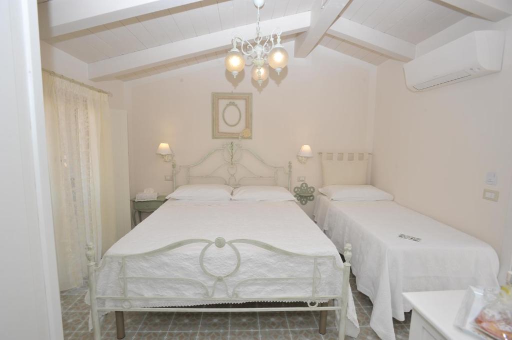 Posteľ alebo postele v izbe v ubytovaní A casa di Nonna Bianca