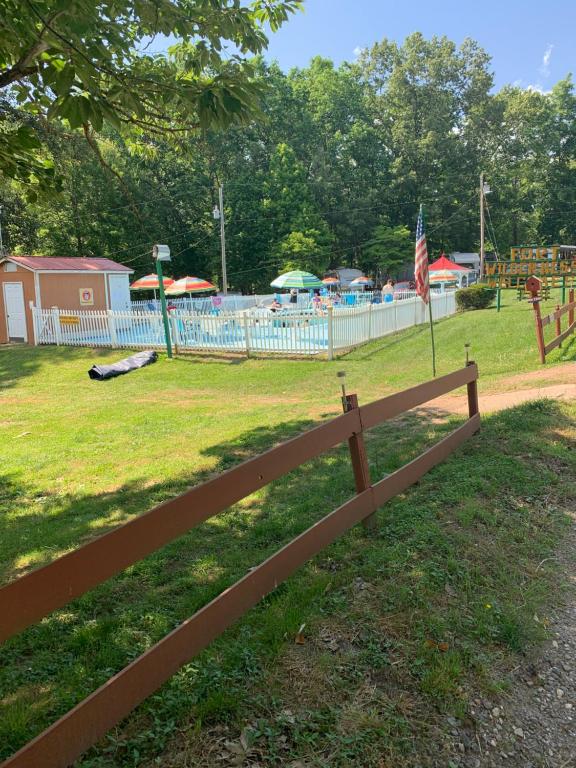 a wooden fence in front of a pool at Ft. Wilderness RV Park and Campground in Whittier