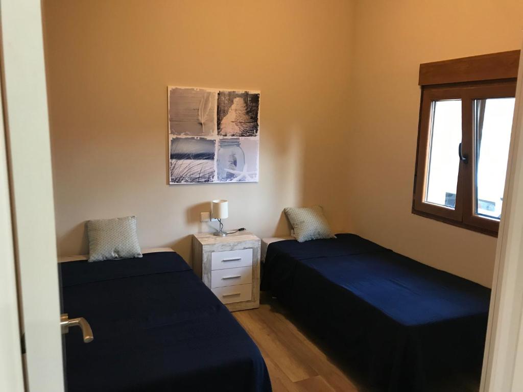Postel nebo postele na pokoji v ubytování Casa la Barbacana