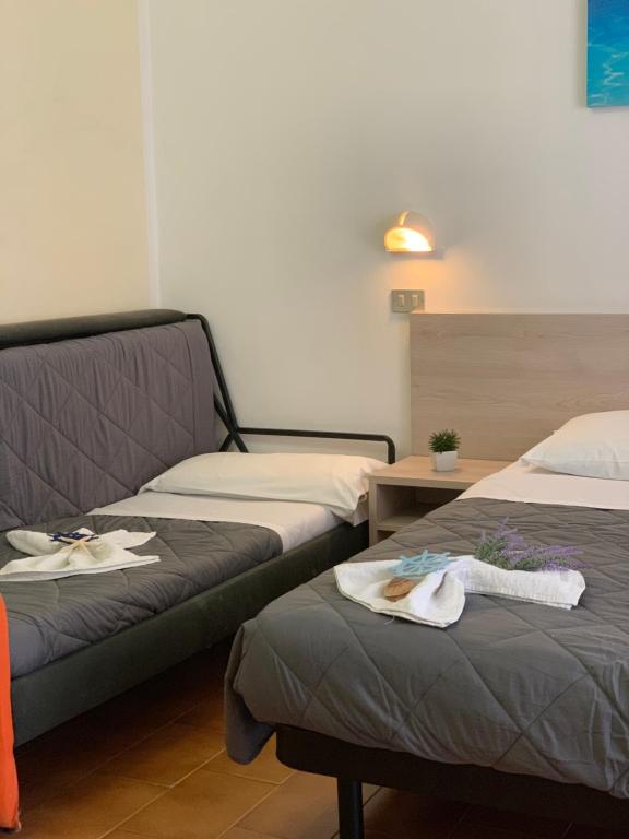 Postel nebo postele na pokoji v ubytování Hotel Palma Benessere