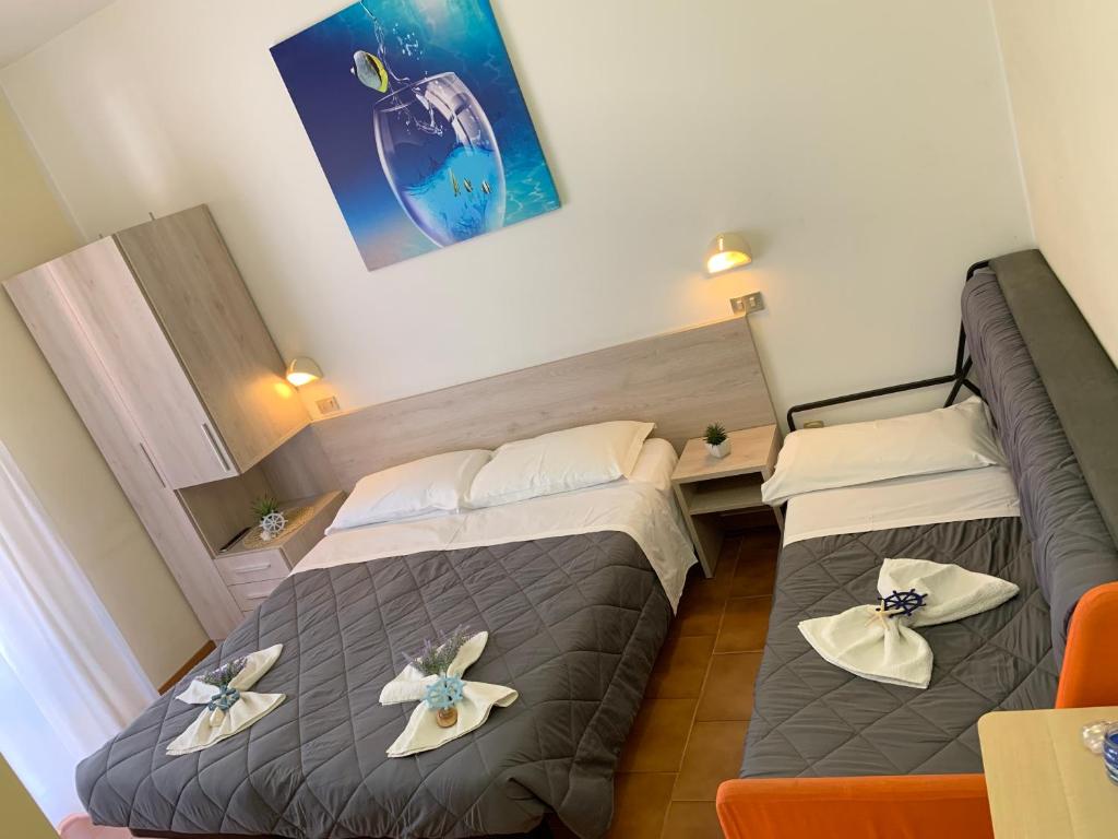 Postel nebo postele na pokoji v ubytování Hotel Palma Benessere