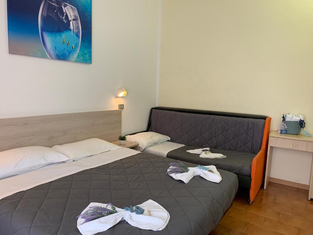 Postel nebo postele na pokoji v ubytování Hotel Palma Benessere