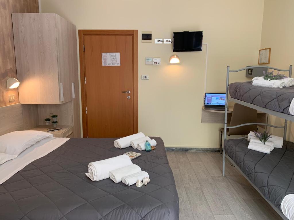 Postel nebo postele na pokoji v ubytování Hotel Palma Benessere