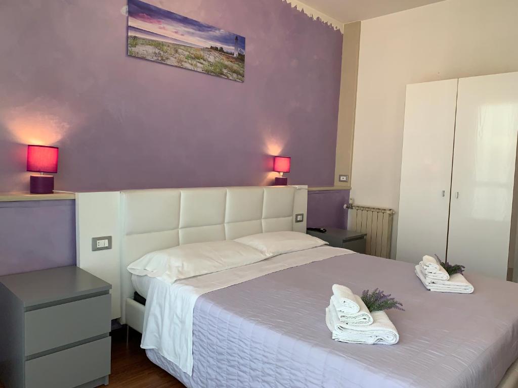 Postel nebo postele na pokoji v ubytování Hotel Palma Benessere