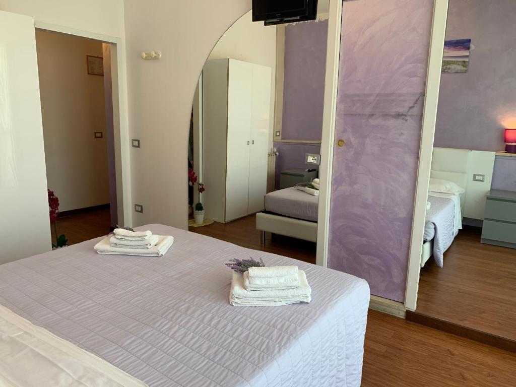 Postel nebo postele na pokoji v ubytování Hotel Palma Benessere