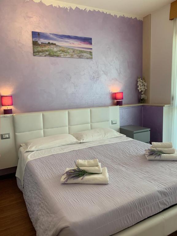 Postel nebo postele na pokoji v ubytování Hotel Palma Benessere