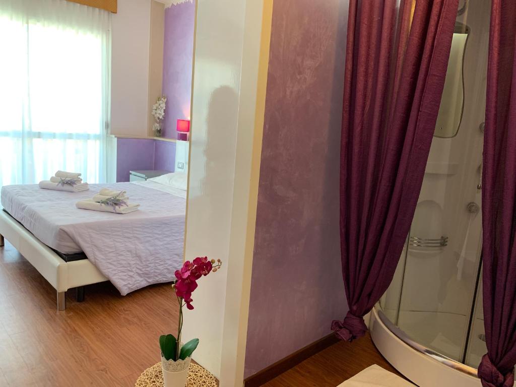 Postel nebo postele na pokoji v ubytování Hotel Palma Benessere