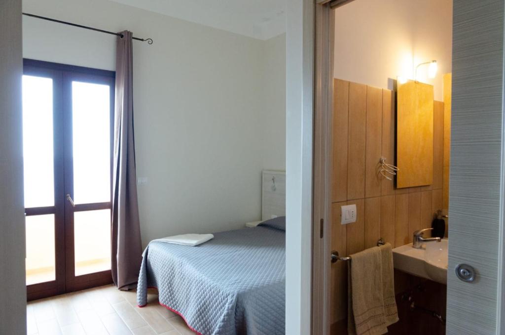 מיטה או מיטות בחדר ב-Hotel Bue Marino