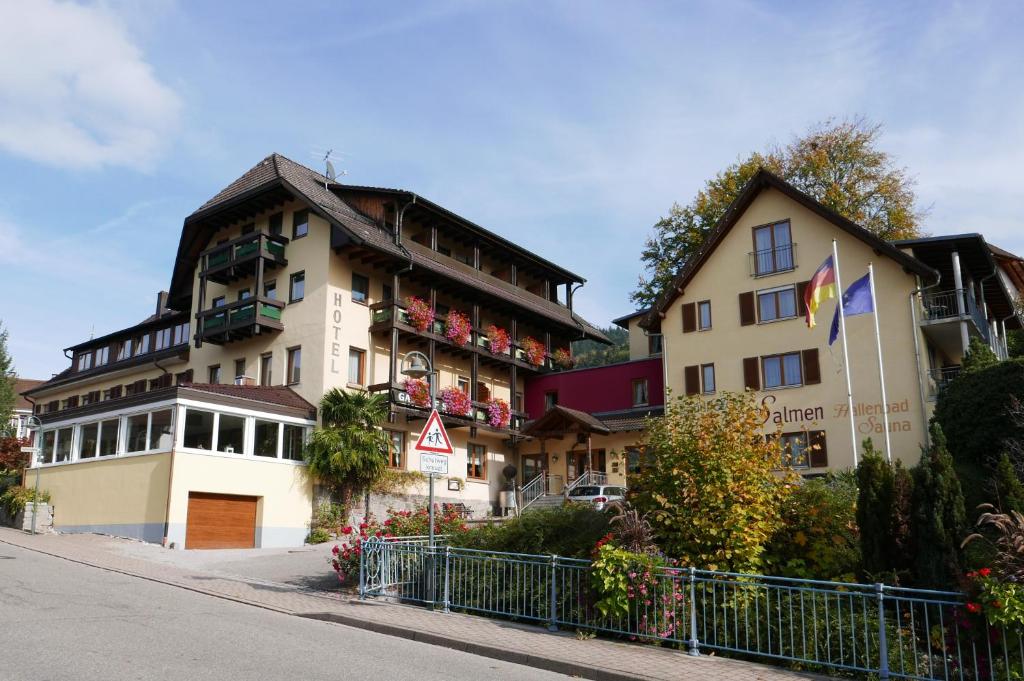 a building with balconies on the side of a street at Landhotel Salmen in Oberkirch