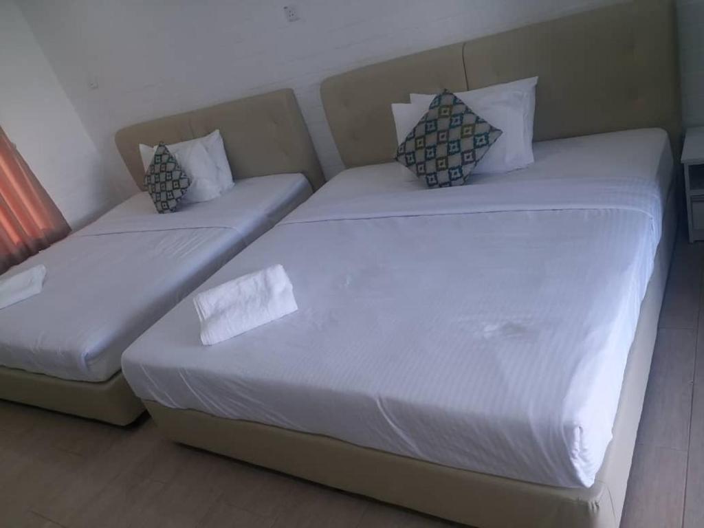Postel nebo postele na pokoji v ubytování D lima beach inn