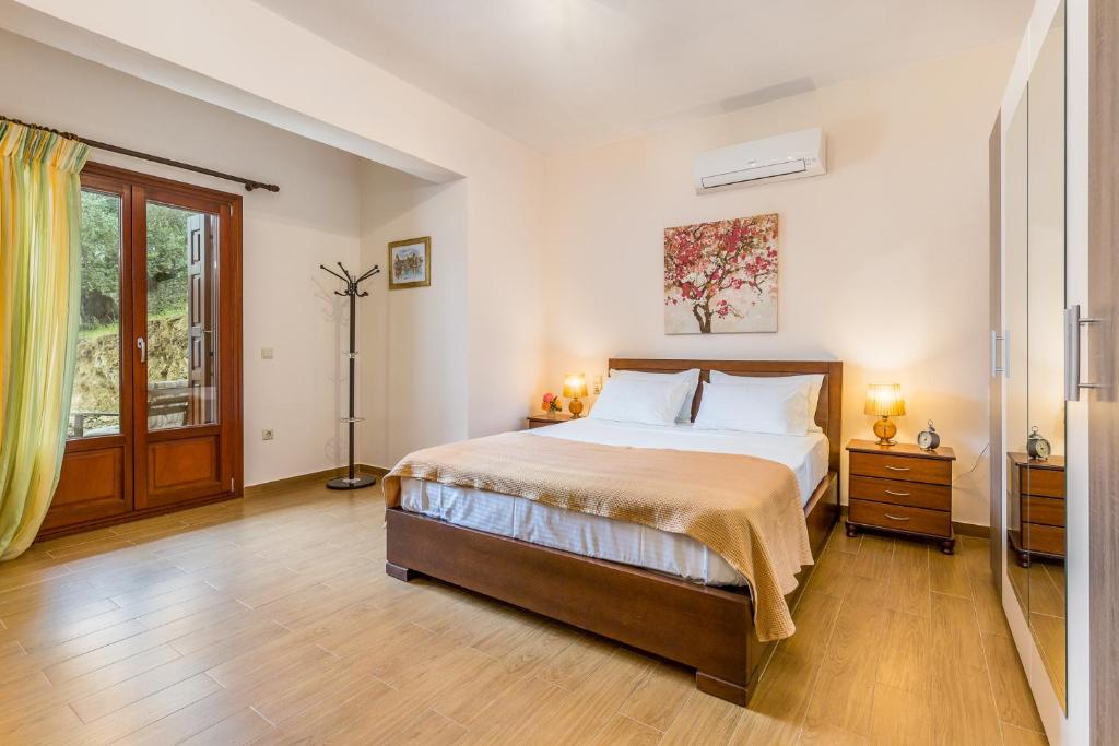 Postel nebo postele na pokoji v ubytování Olive Grove Apartment