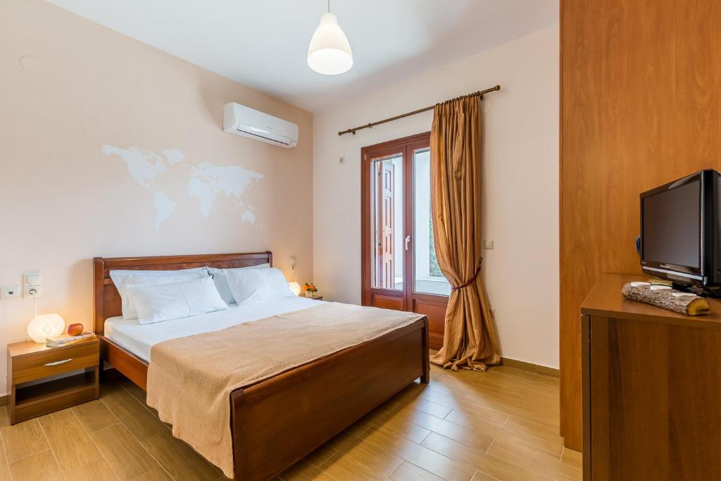 Postel nebo postele na pokoji v ubytování Olive Grove Apartment