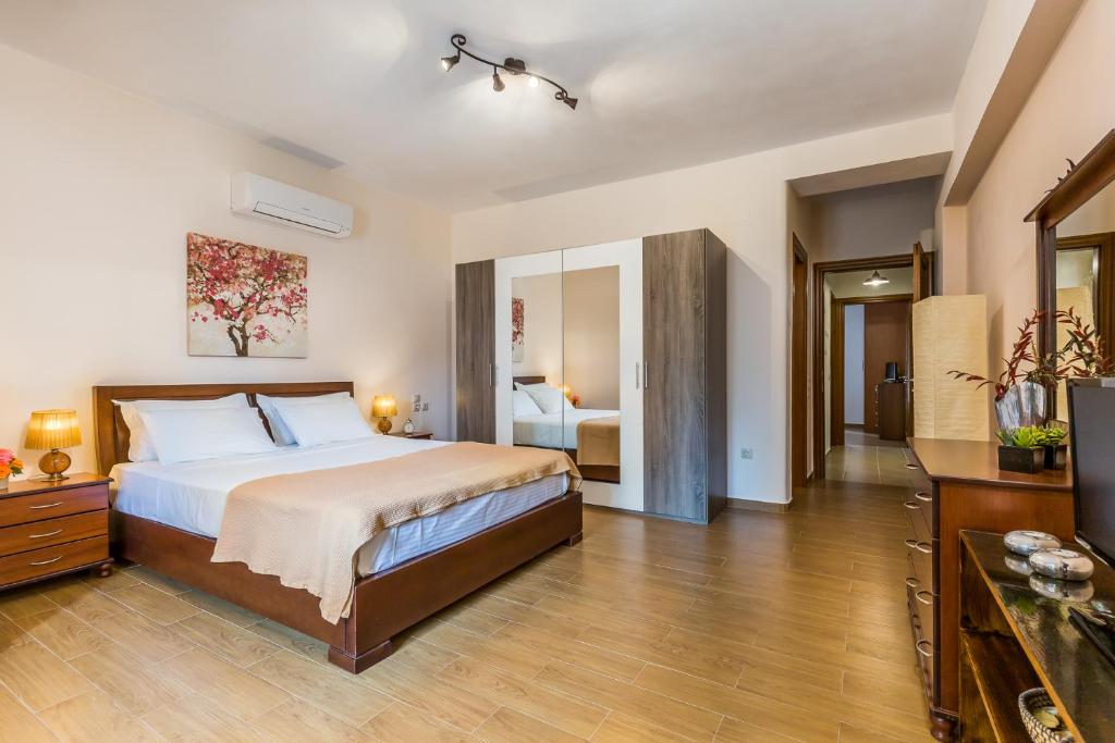 Postel nebo postele na pokoji v ubytování Olive Grove Apartment