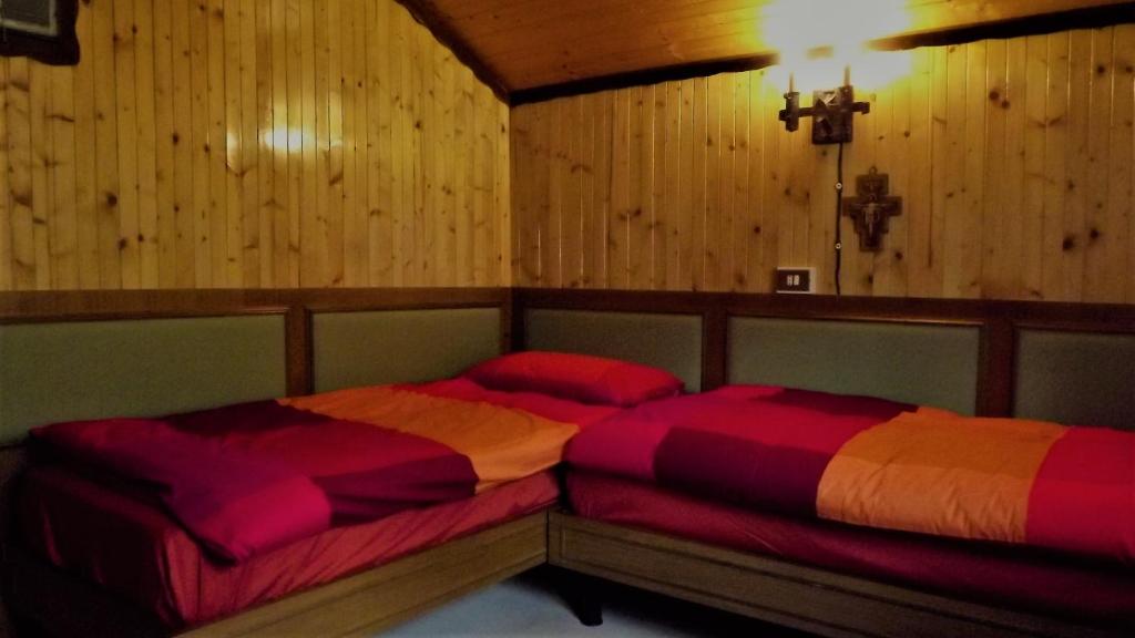 Postel nebo postele na pokoji v ubytování Chalet del frassino