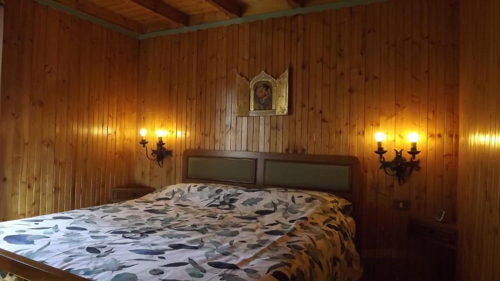 Postel nebo postele na pokoji v ubytování Chalet del frassino