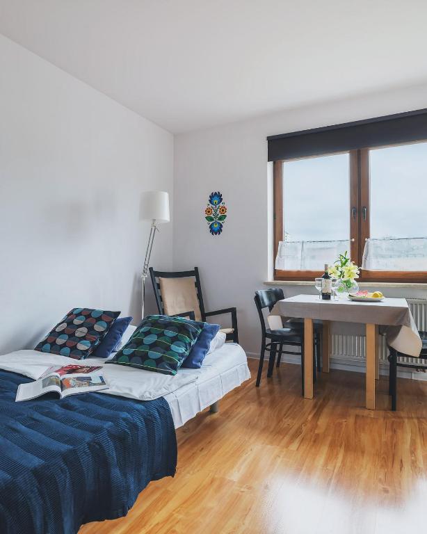 Posteľ alebo postele v izbe v ubytovaní P&O Apartments Namyslowska