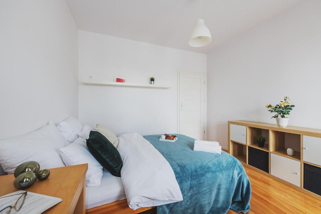 Posteľ alebo postele v izbe v ubytovaní P&O Apartments Namyslowska