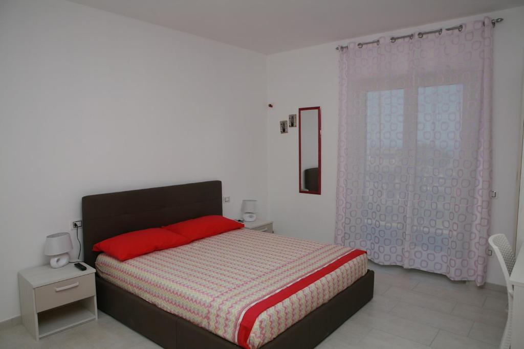 Posteľ alebo postele v izbe v ubytovaní B&B Torre Nave