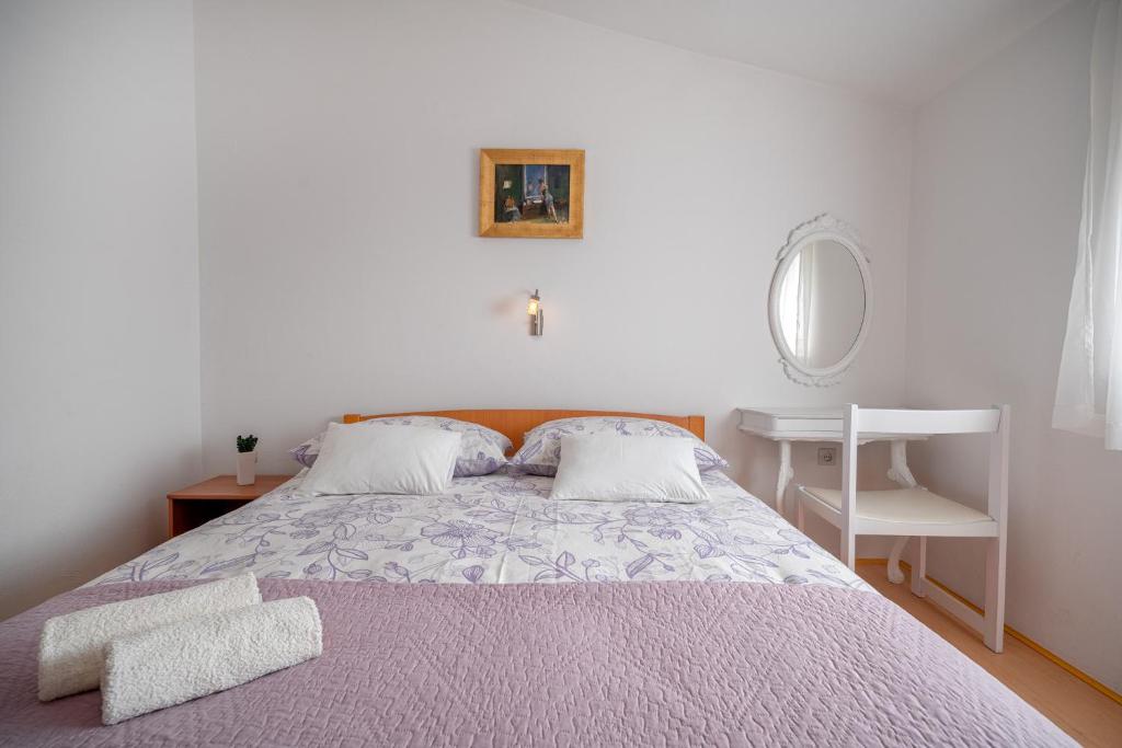 Postel nebo postele na pokoji v ubytování Apartman Skroza