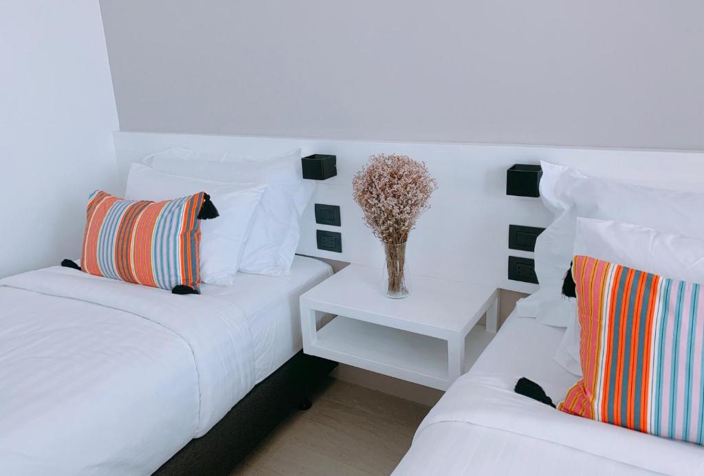 Postel nebo postele na pokoji v ubytování Blue Tao Beach Hotel - SHA Plus
