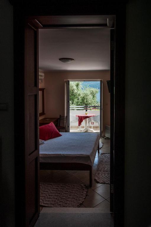 Postel nebo postele na pokoji v ubytování Apartments Mako
