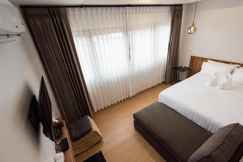 Postel nebo postele na pokoji v ubytování U Chiangkhan