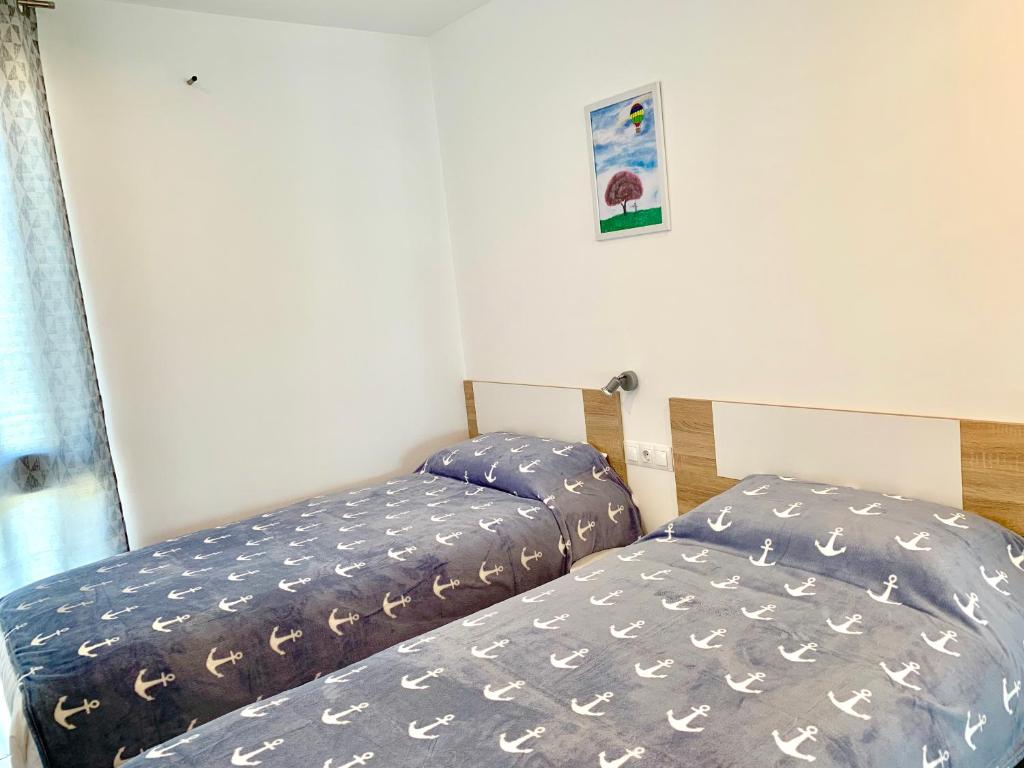A bed or beds in a room at Edifici Valeria
