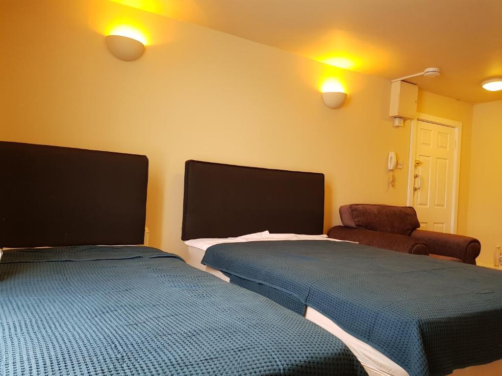 Postel nebo postele na pokoji v ubytování KGT House