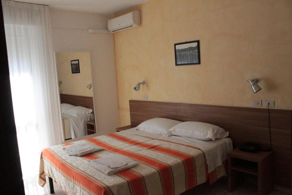 Postel nebo postele na pokoji v ubytování Hotel Derna