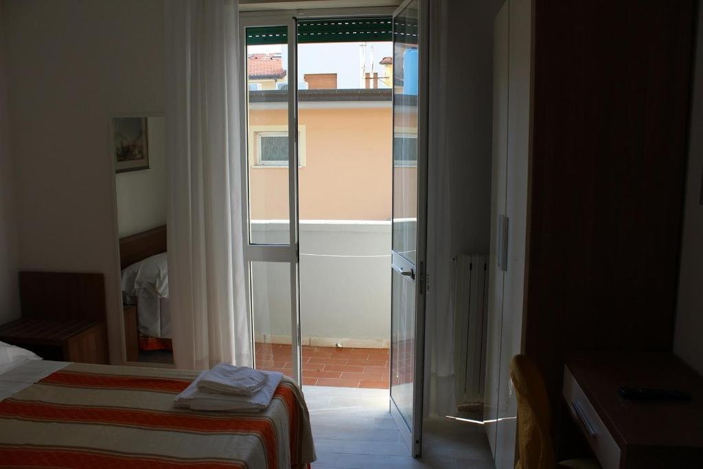 Postel nebo postele na pokoji v ubytování Hotel Derna